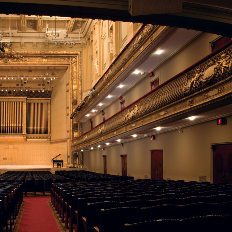 A view of the empty Symphony Hall, with the stage in the distance